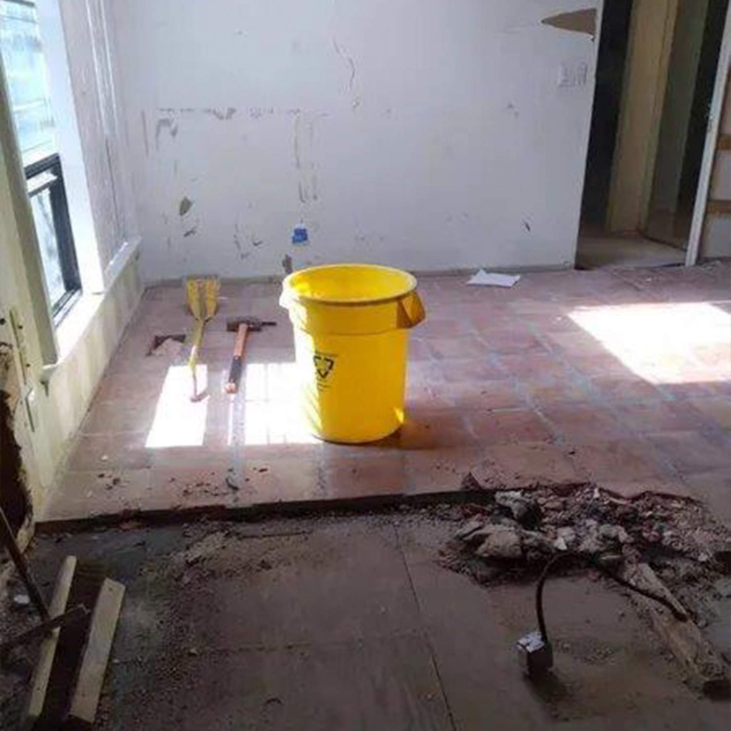 a yellow bucket on the floor