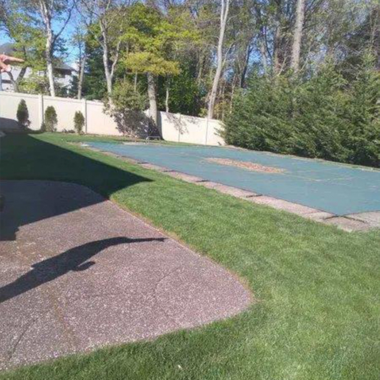 a basketball court in a yard
